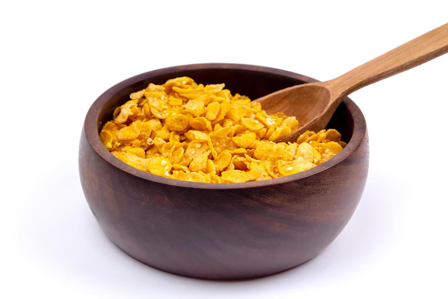 Healthy lifestyle breakfast bowl with granola and spoon on white background photo