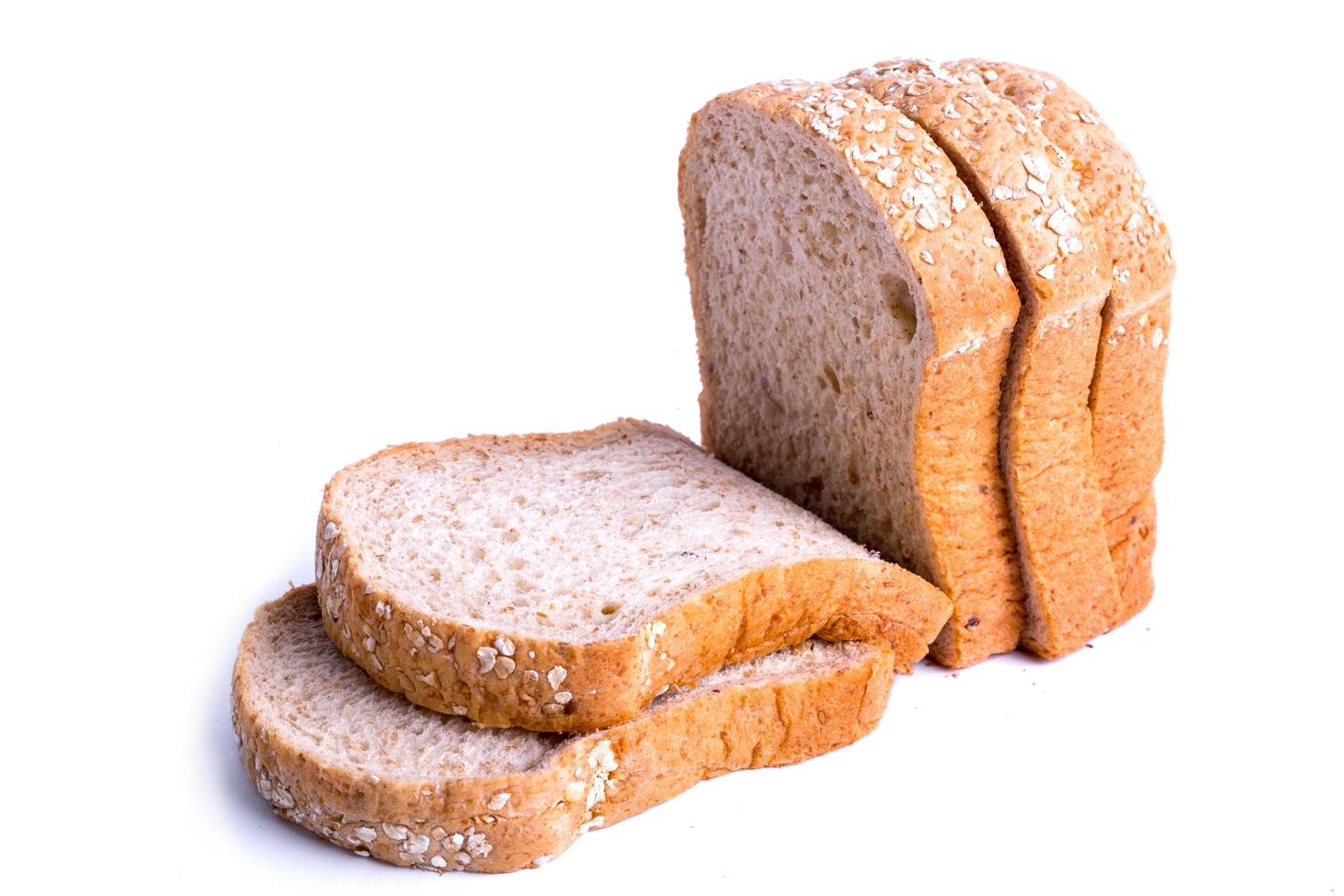 Slice whole wheat bread isolated on white background photo