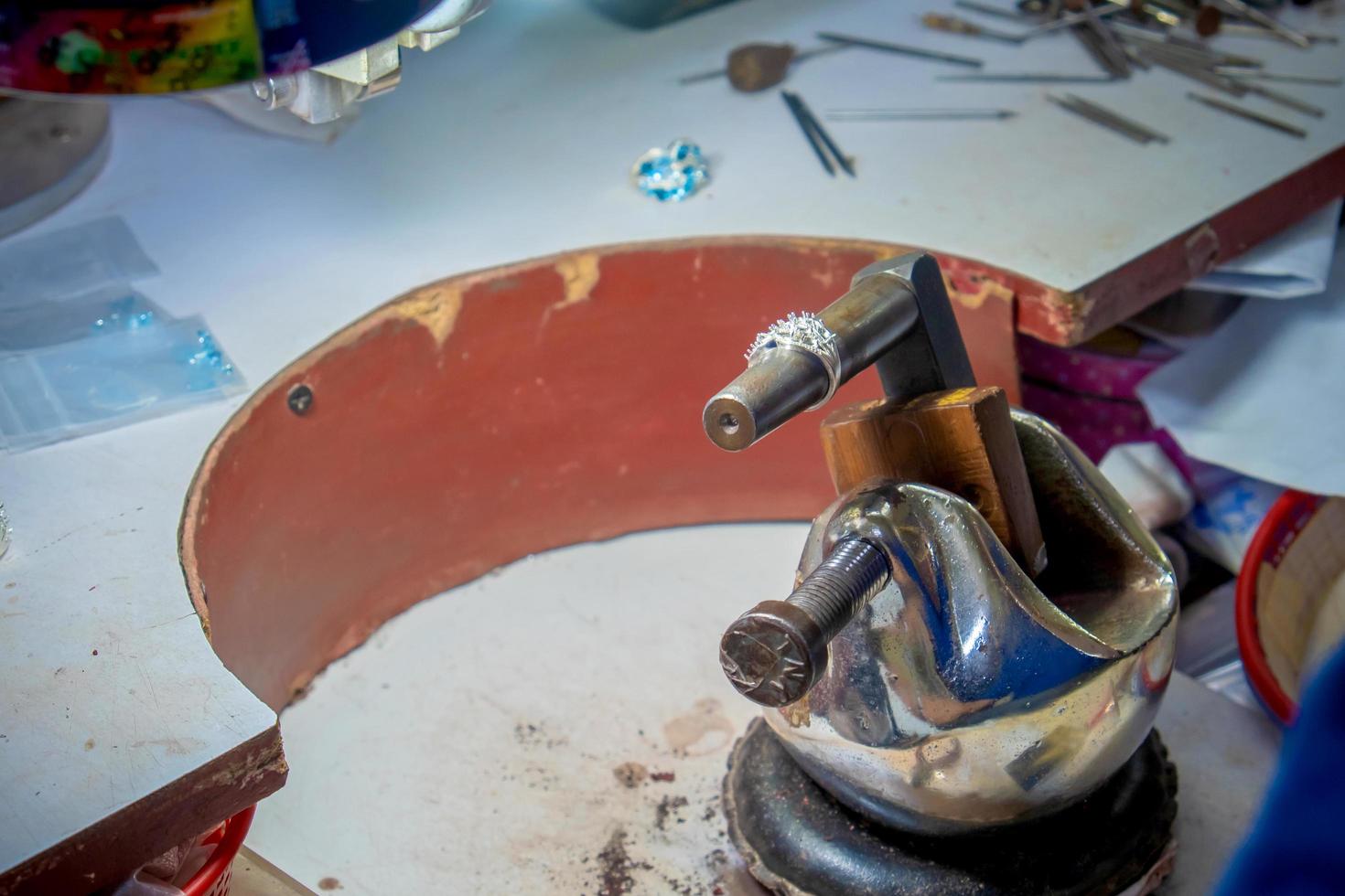 Ring on working desk for craft jewelery making photo