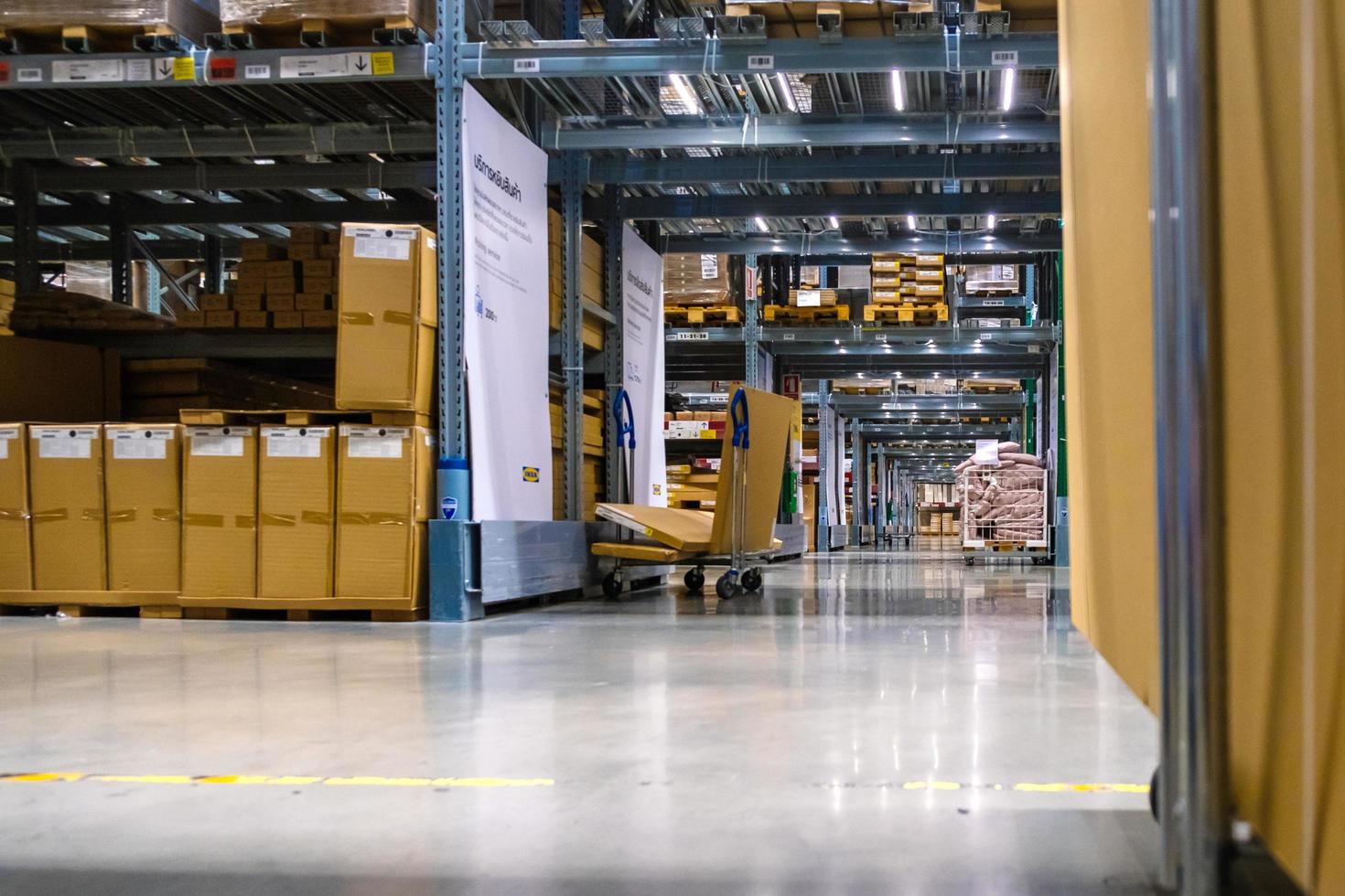 A cart in warehouse aisle in an IKEA store photo