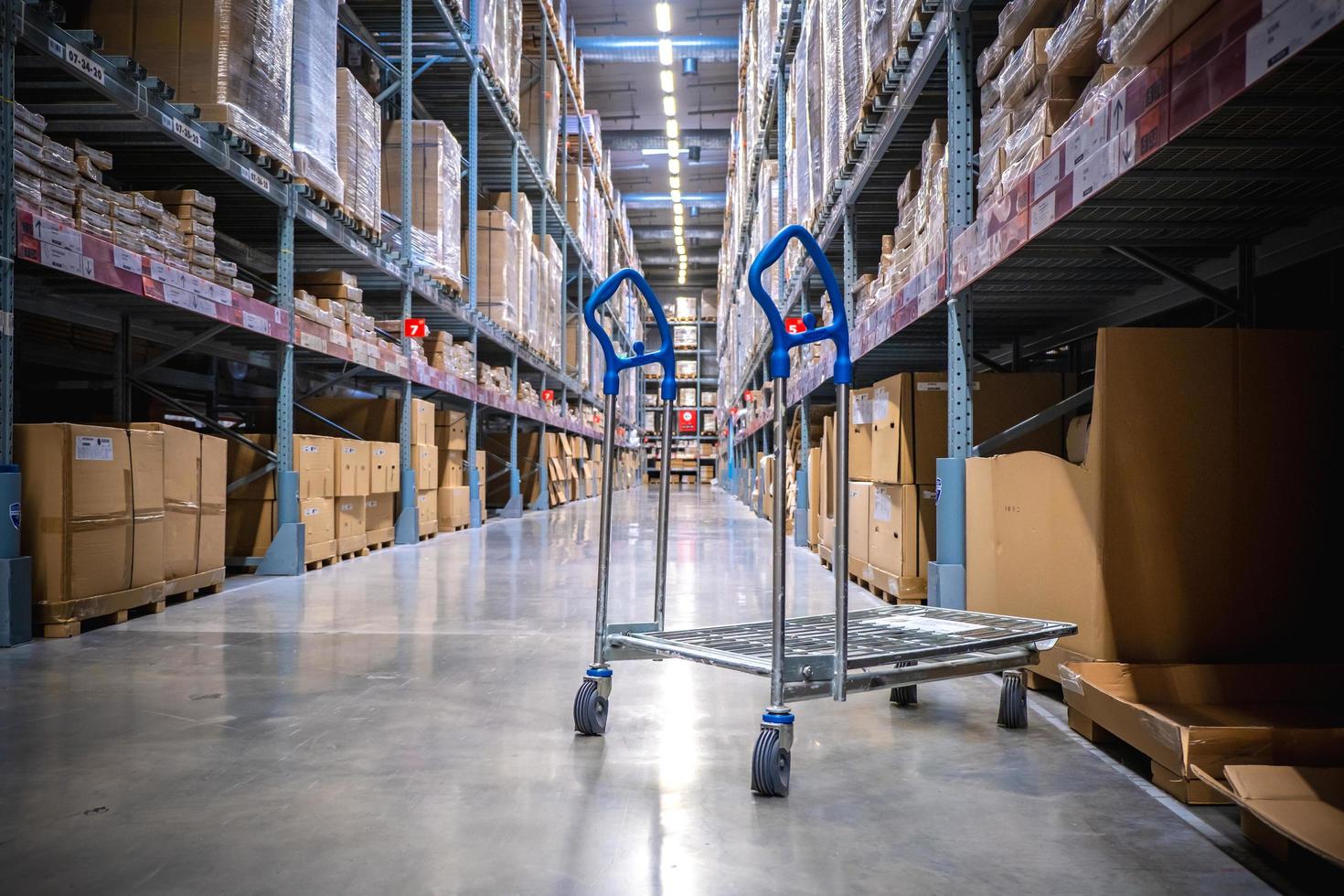 A cart in warehouse aisle in an IKEA store photo