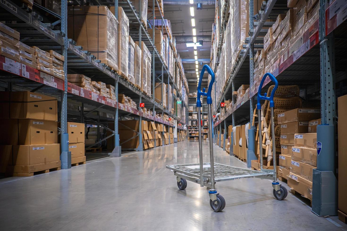 A cart in warehouse aisle in an IKEA store photo