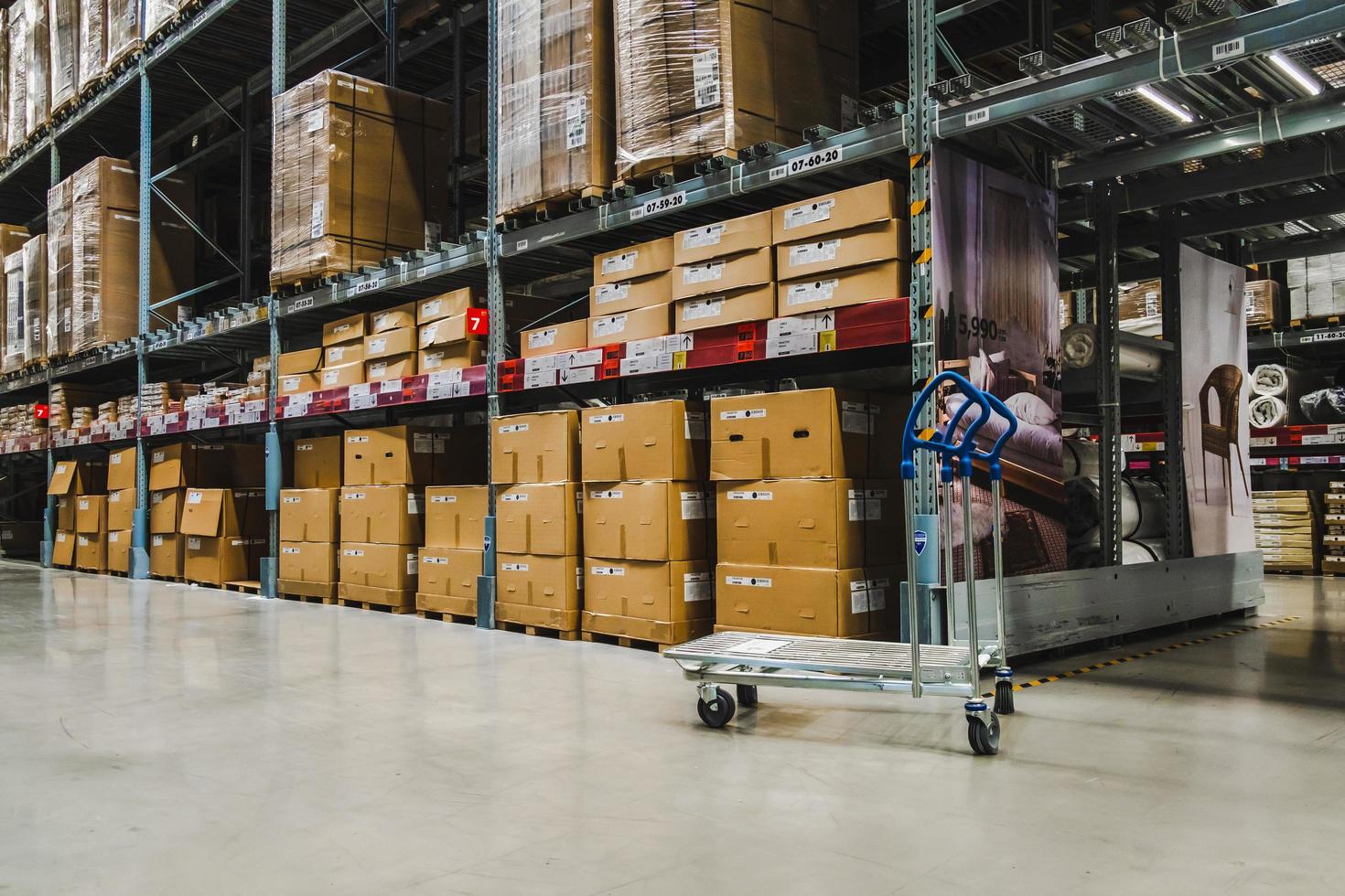 A cart in warehouse aisle in an IKEA store photo