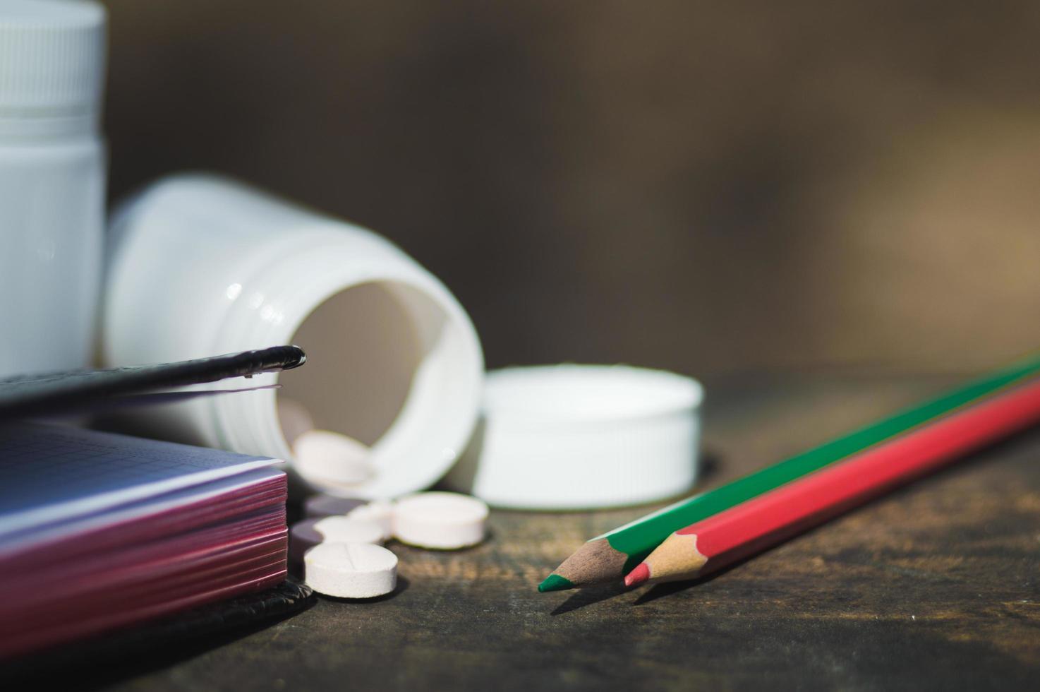 White  pills lie on an old bench photo