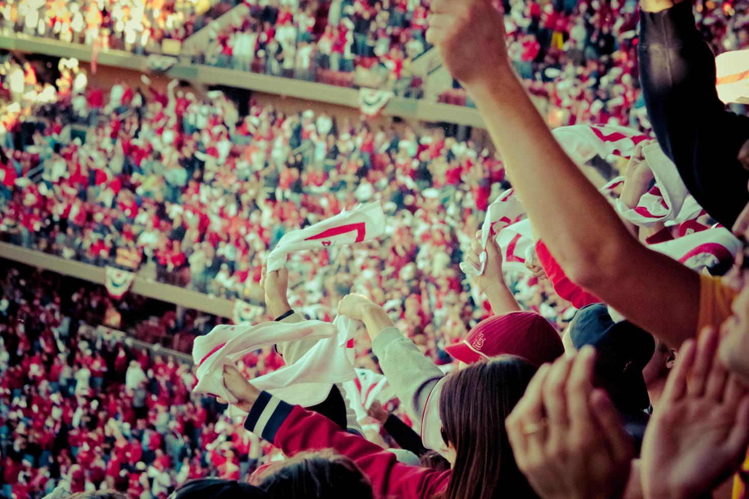 City, Country, MM, DD, YYYY - People cheering in the stands photo