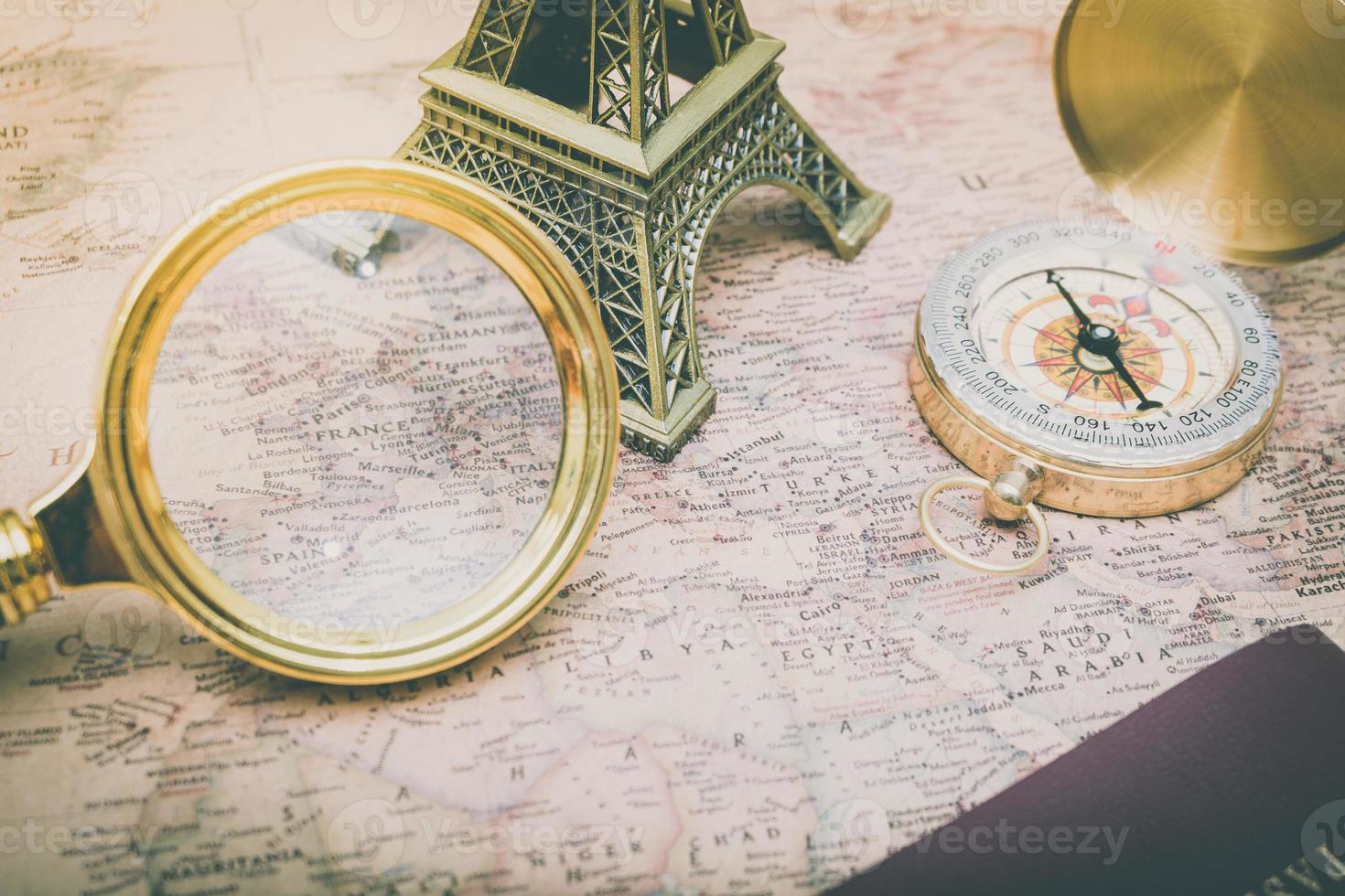 Looking France on world map using a magnifying glass soft focus photo