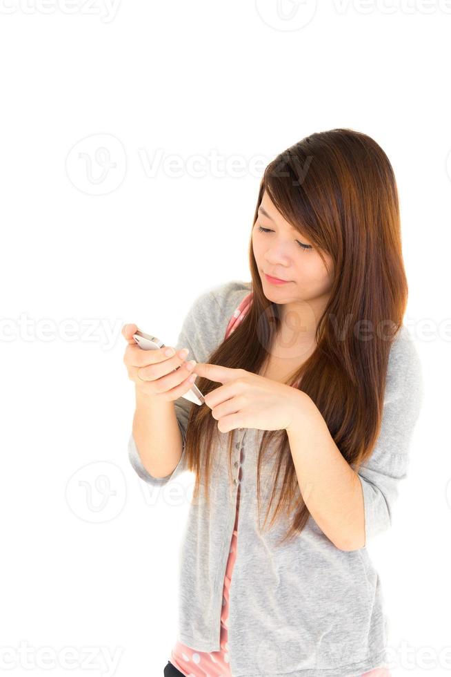 Thai woman chat with someone by moblie phone on white background and blank area at left side photo