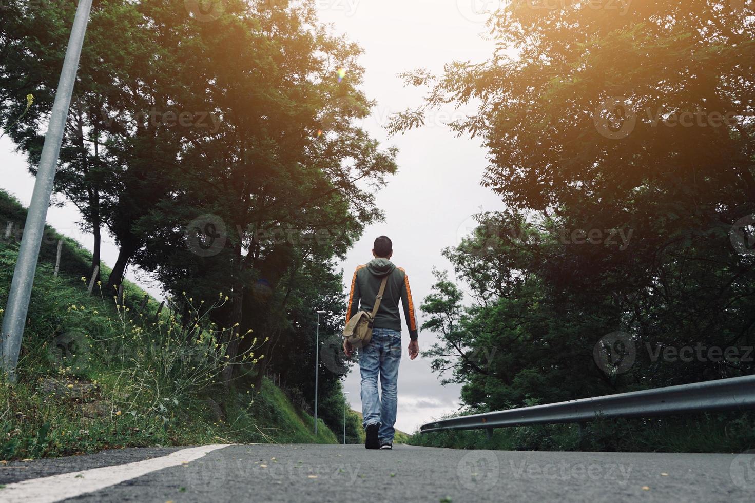 man trekking on the mountain photo