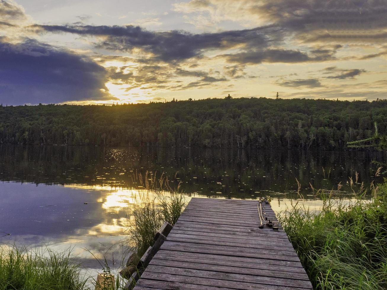 The wooden dock at sunset photo