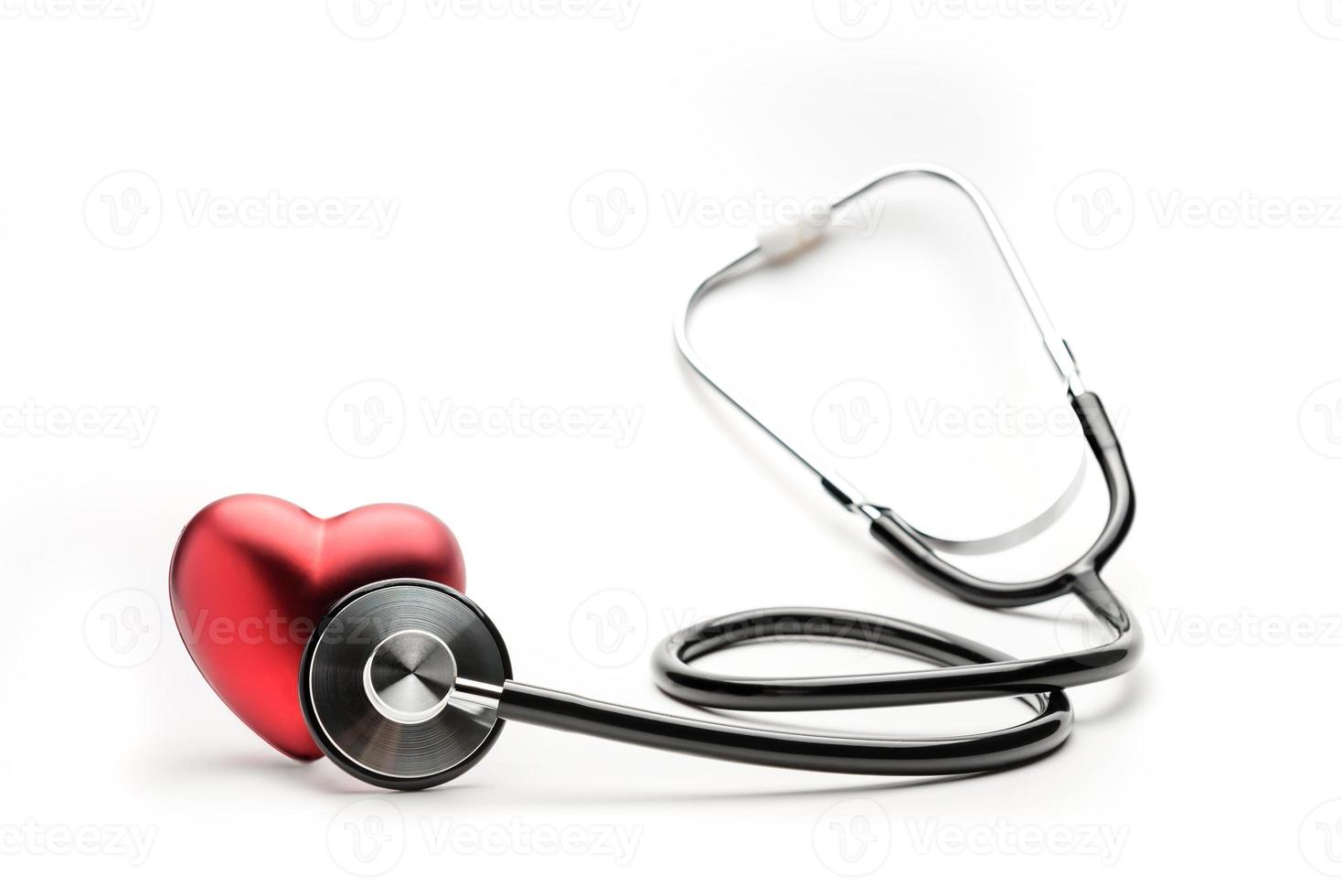 A stethoscope listens to a red heart photo
