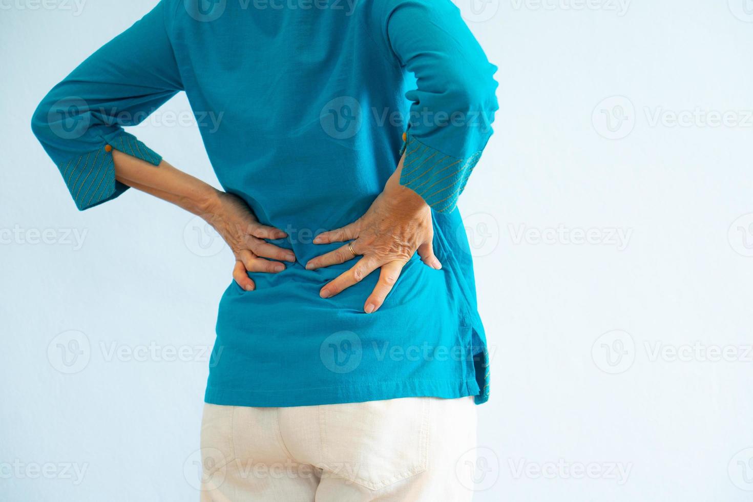 Portrait of senior woman getting backache from degeneration photo