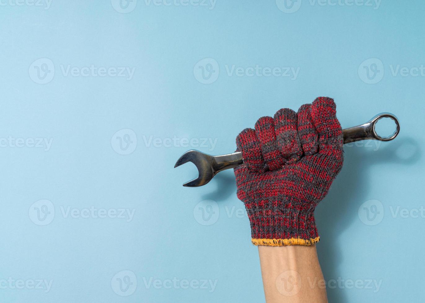 Hand a man hold spanner tool photo