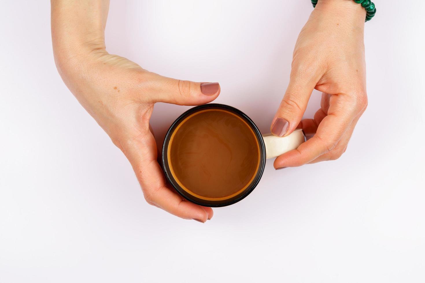 Holding a cup of coffee photo