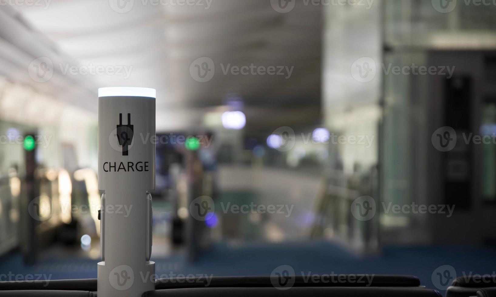 Charging port for mobile devices in modern airport photo