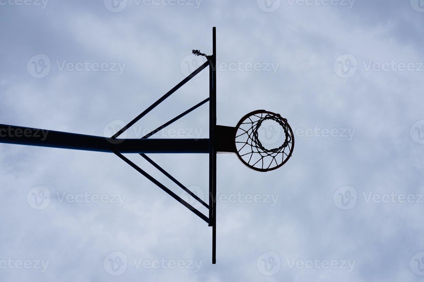 street basketball hoop and blue sky photo