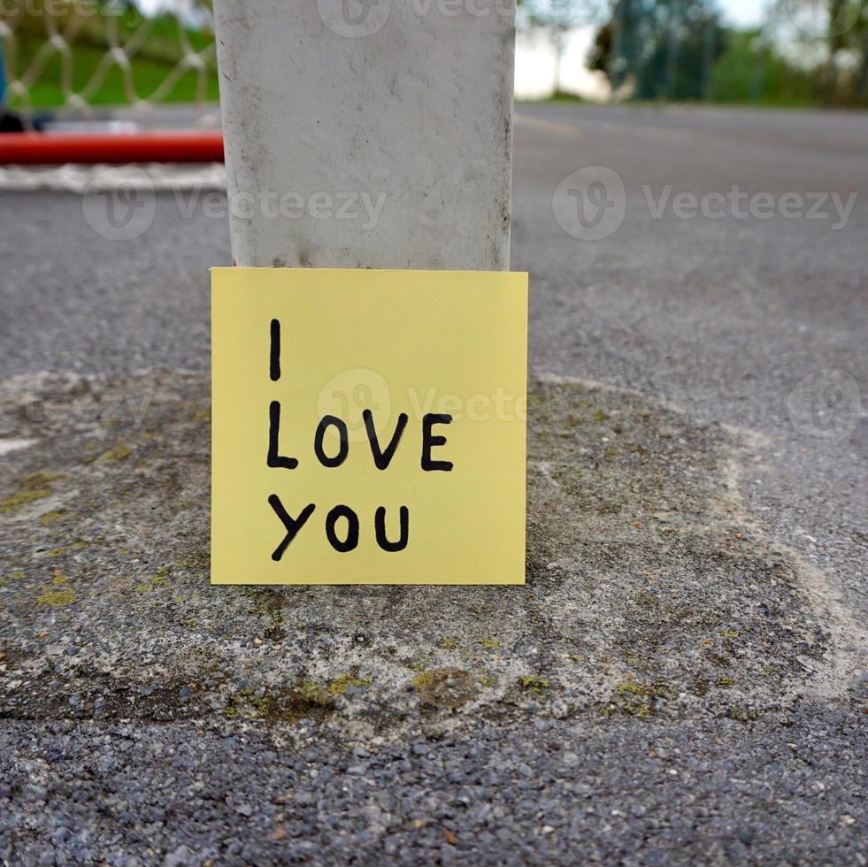 I love you written on a paper photo