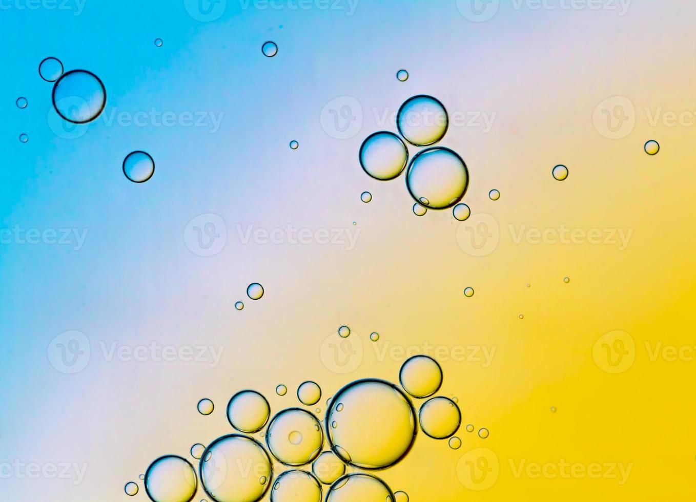 Abstract Background of Oil Bubbles on Water Surface Cyan Orange palette photo