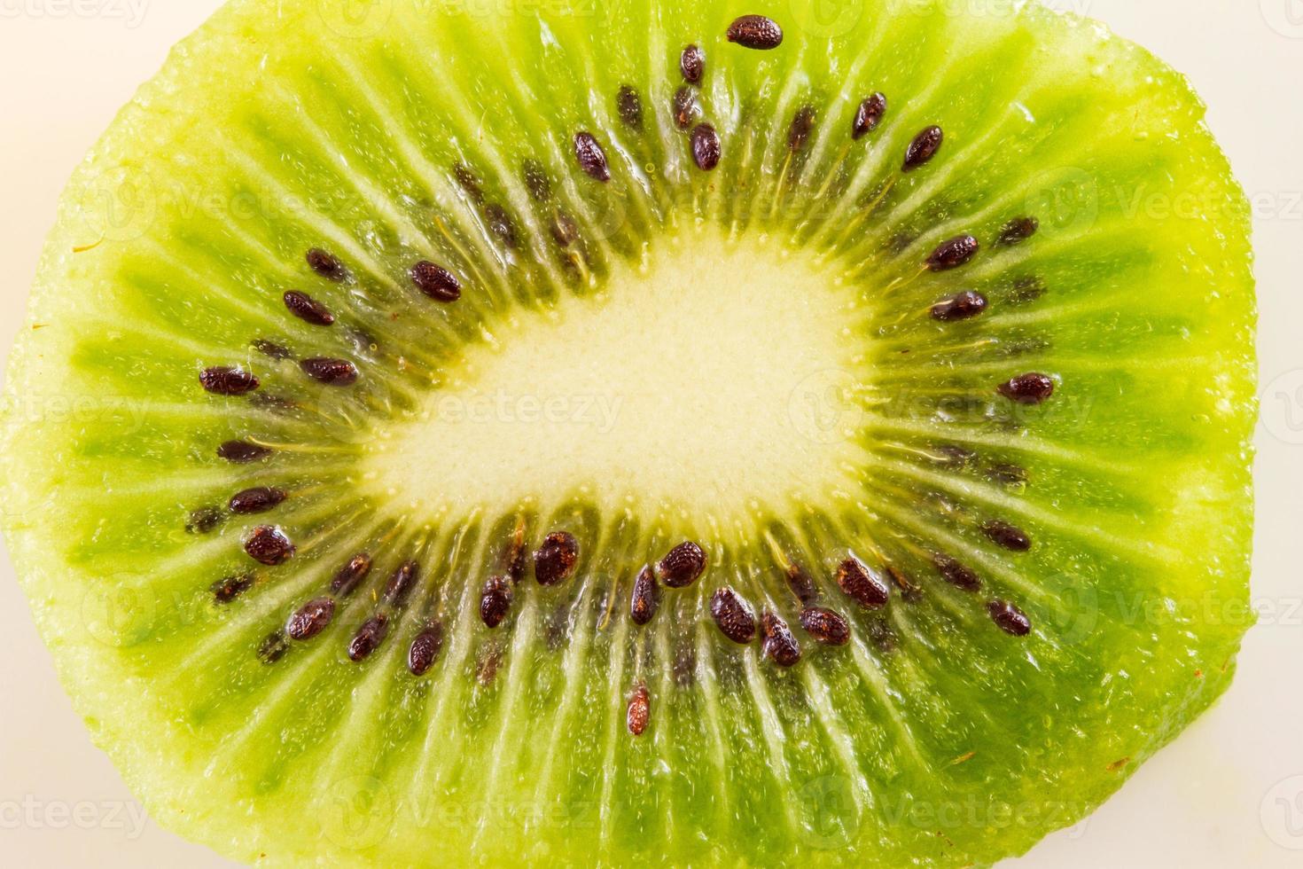 Background of kiwi fruit cut in half photo