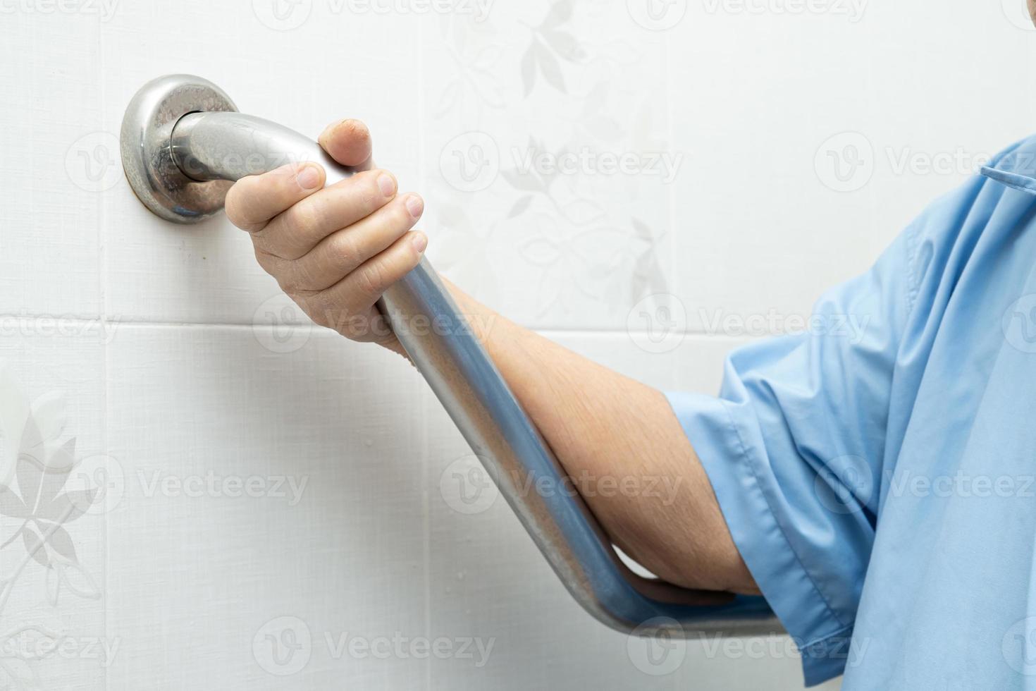 Asian senior or elderly old lady woman patient use toilet bathroom handle security in nursing hospital ward healthy strong medical concept photo