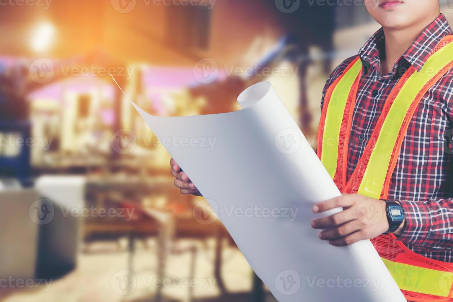 Engineer man construction worker conceptblue print photo