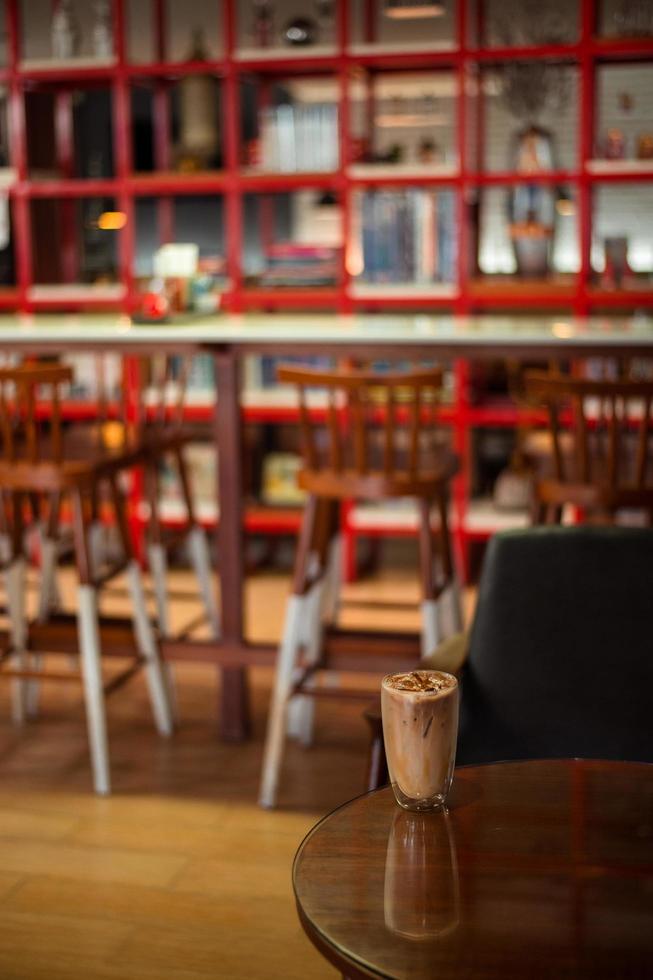 Iced coffee on a table inside a cafe photo