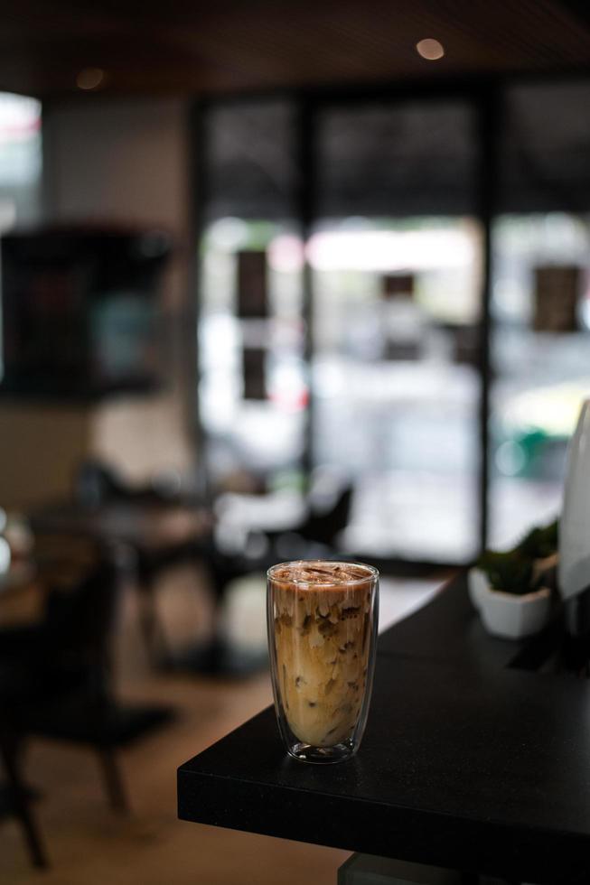 Iced coffee on a table inside a cafe photo