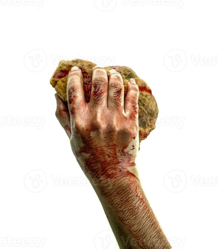 Hand holding stone bloody on white background photo