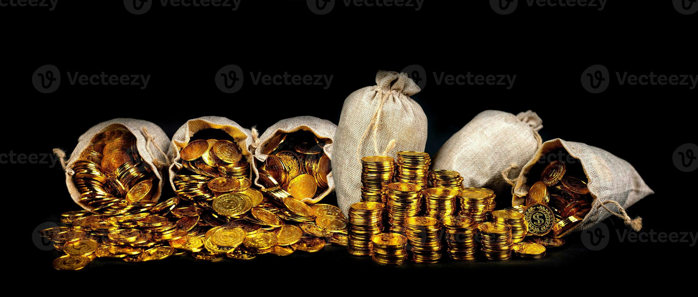 Stacking gold coin in treasure sack photo