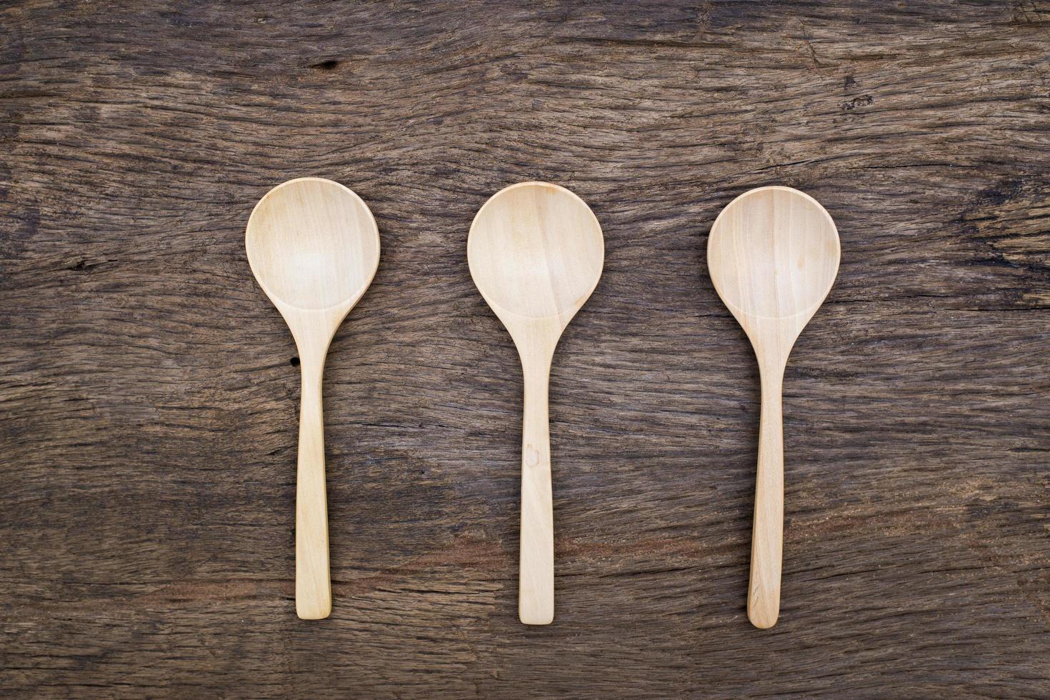 Wooden spoon on wood table photo