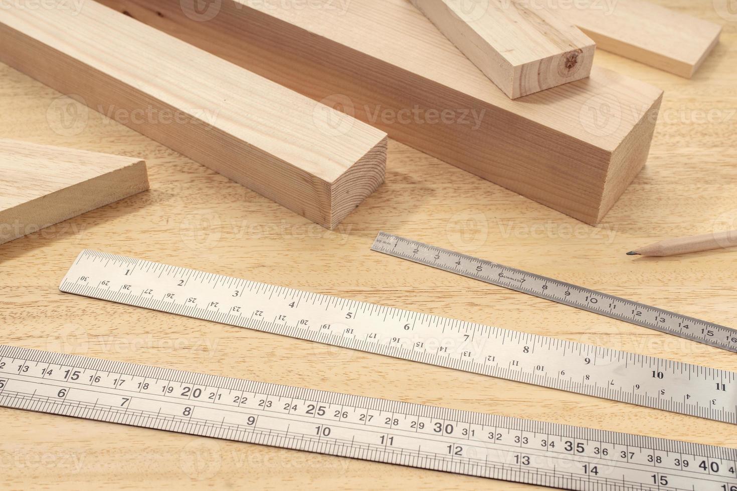 Group of assorted Wood material with professional rulers Carpentry timber measuring or woodwork concept photo