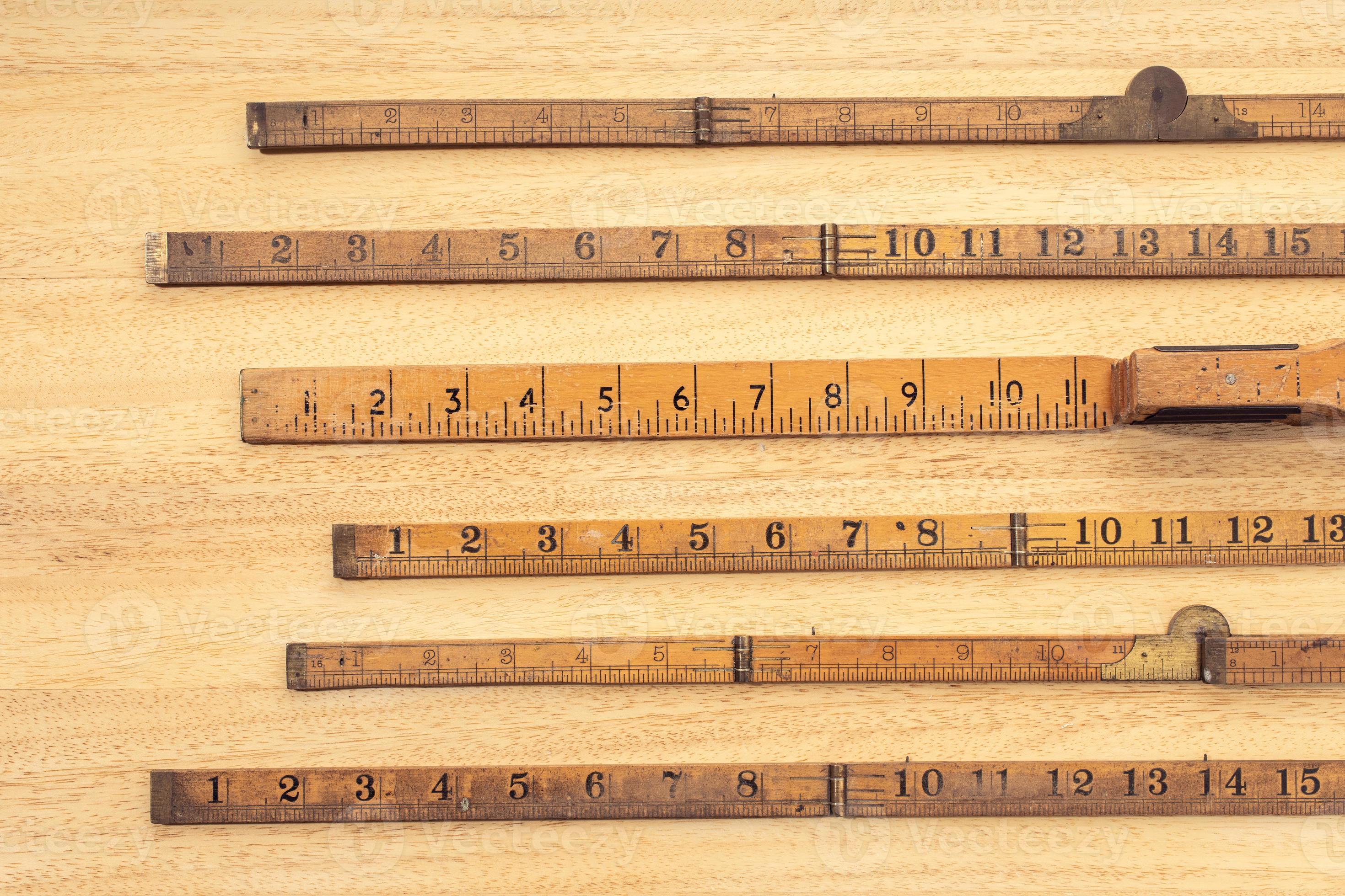 Group of Old wooden ruler on table Measuring or accuracy concept