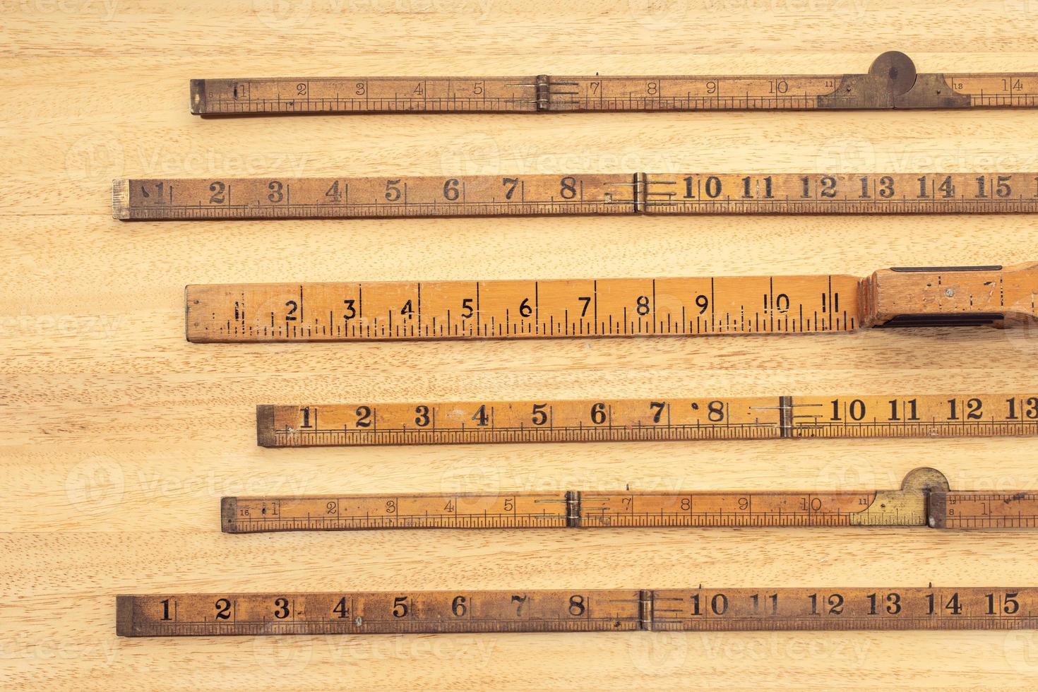Group of Old wooden ruler on table Measuring or accuracy concept photo