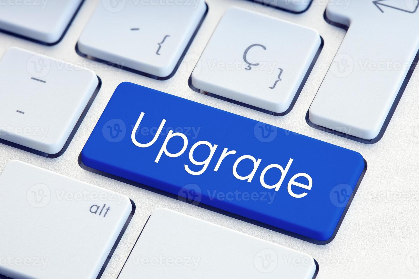 Upgrade Word on blue computer Keyboard Key photo