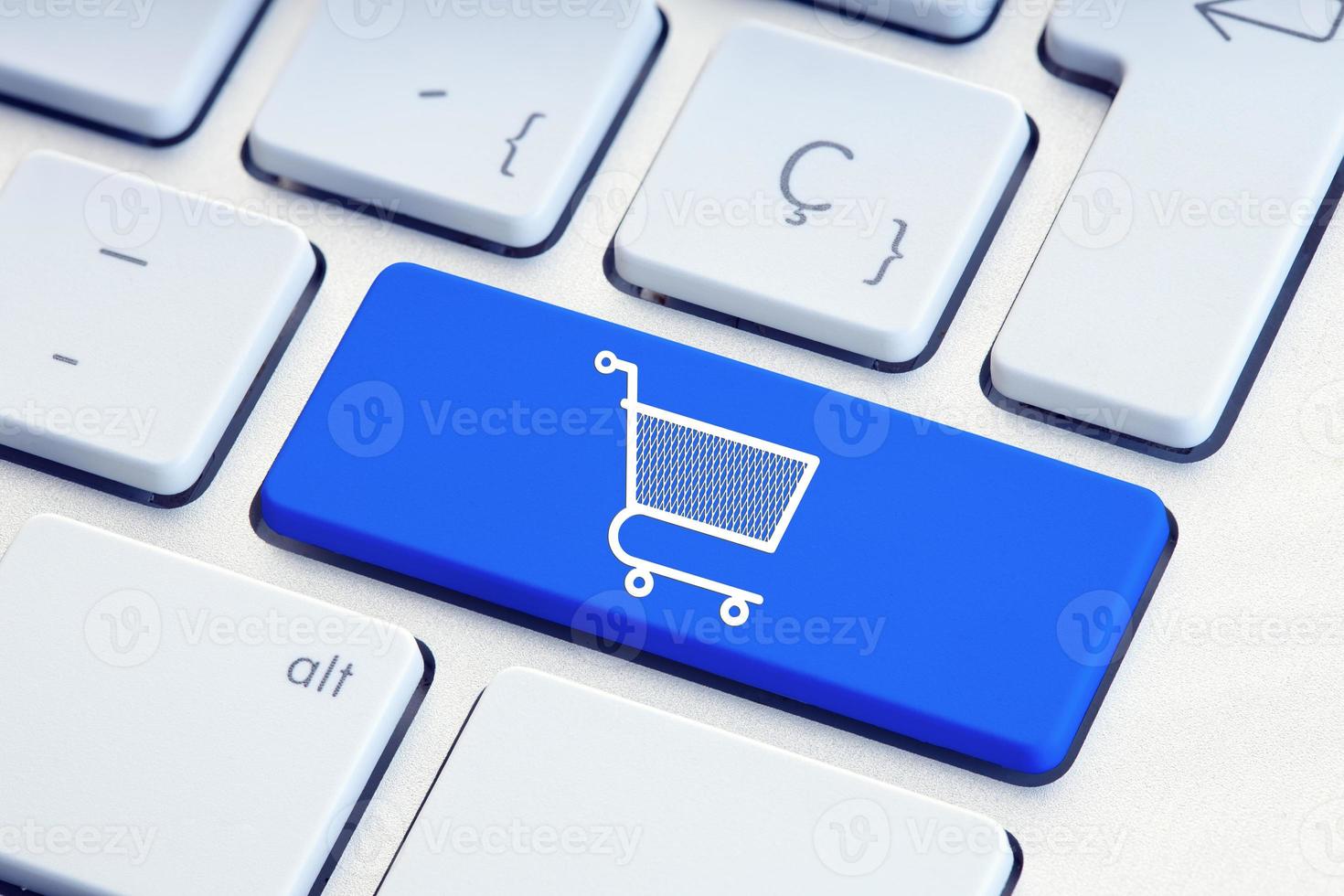 Online shopping ecommerce internet shopping concept Shopping cart icon on blue keyboard key photo