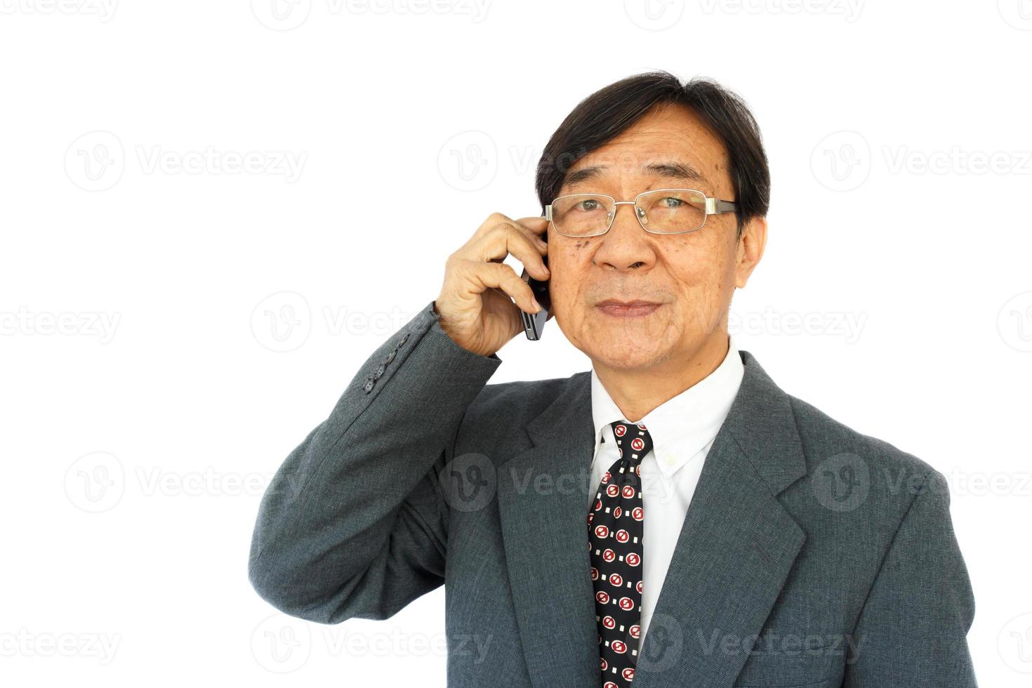 old aged thai businessman is calling and blank area at left side photo