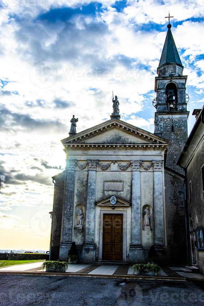 facade bell tower and sunrise photo