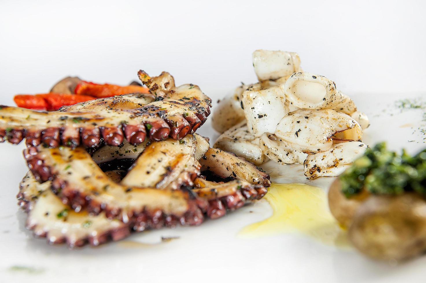 Octopus and squid grilled with vegetables photo