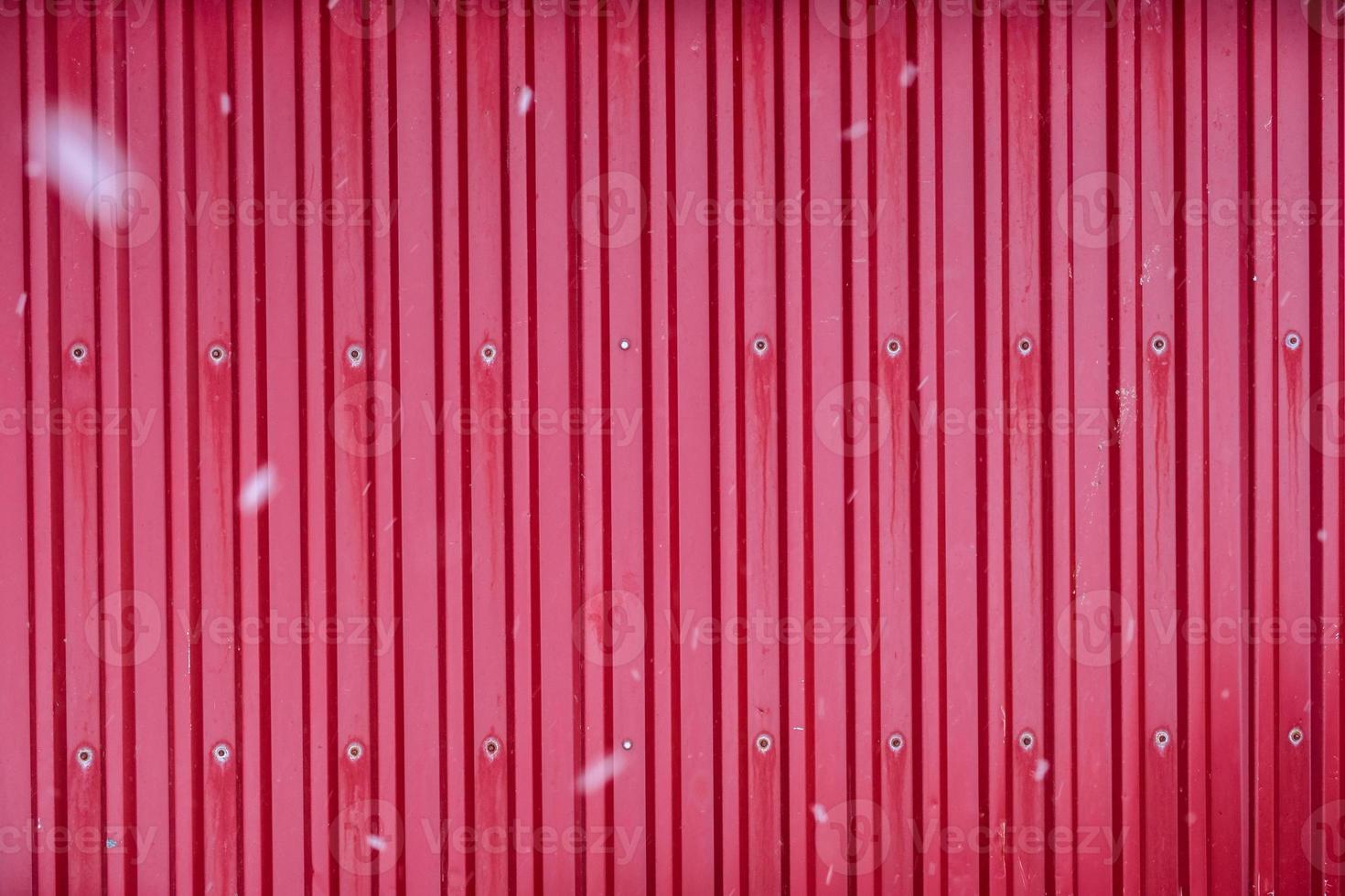 Red surface container warehouse lined with snowing photo