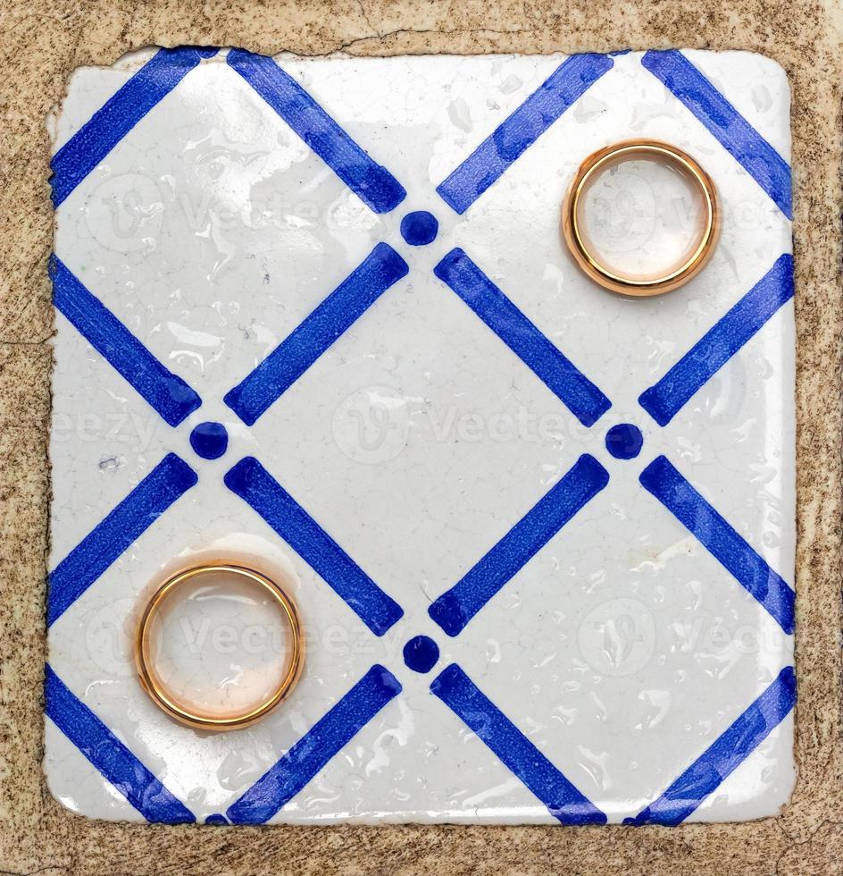 Two golden rings with geometric pattern photo