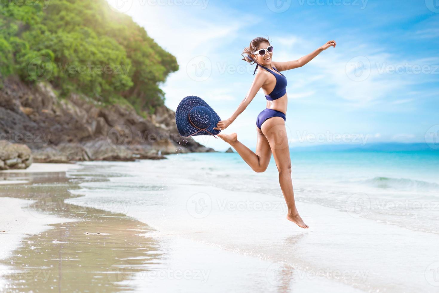 Sexy woman in the blue bikini on beach photo