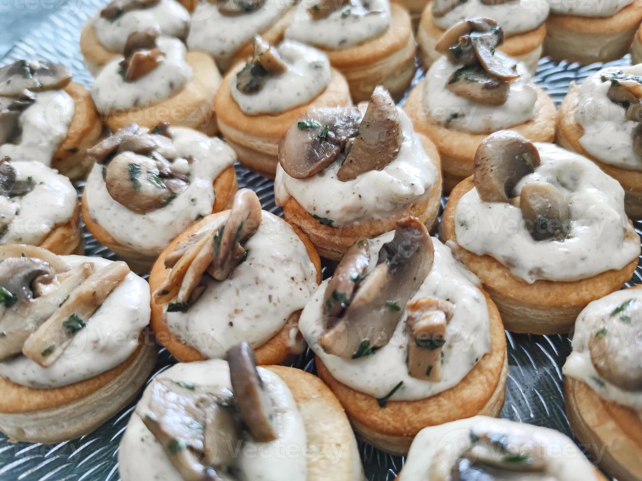 Fresh mushroom cream and puff pastry appetizer photo