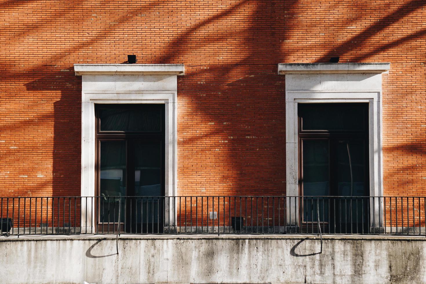 window on the red facade of the house photo