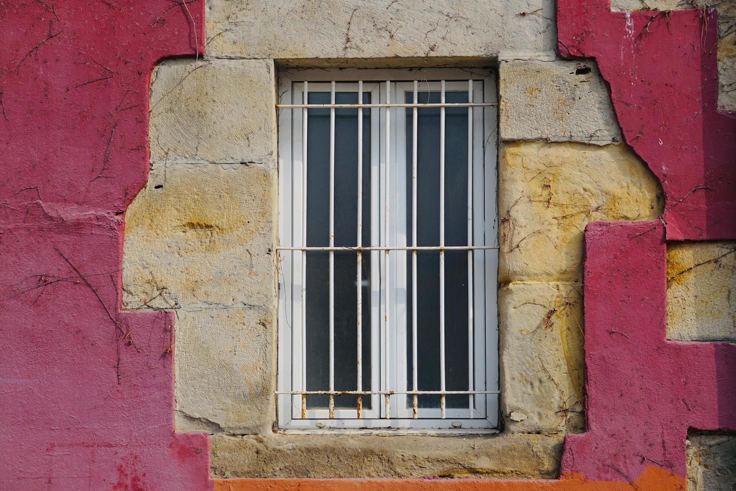 window on the red facade of the house photo