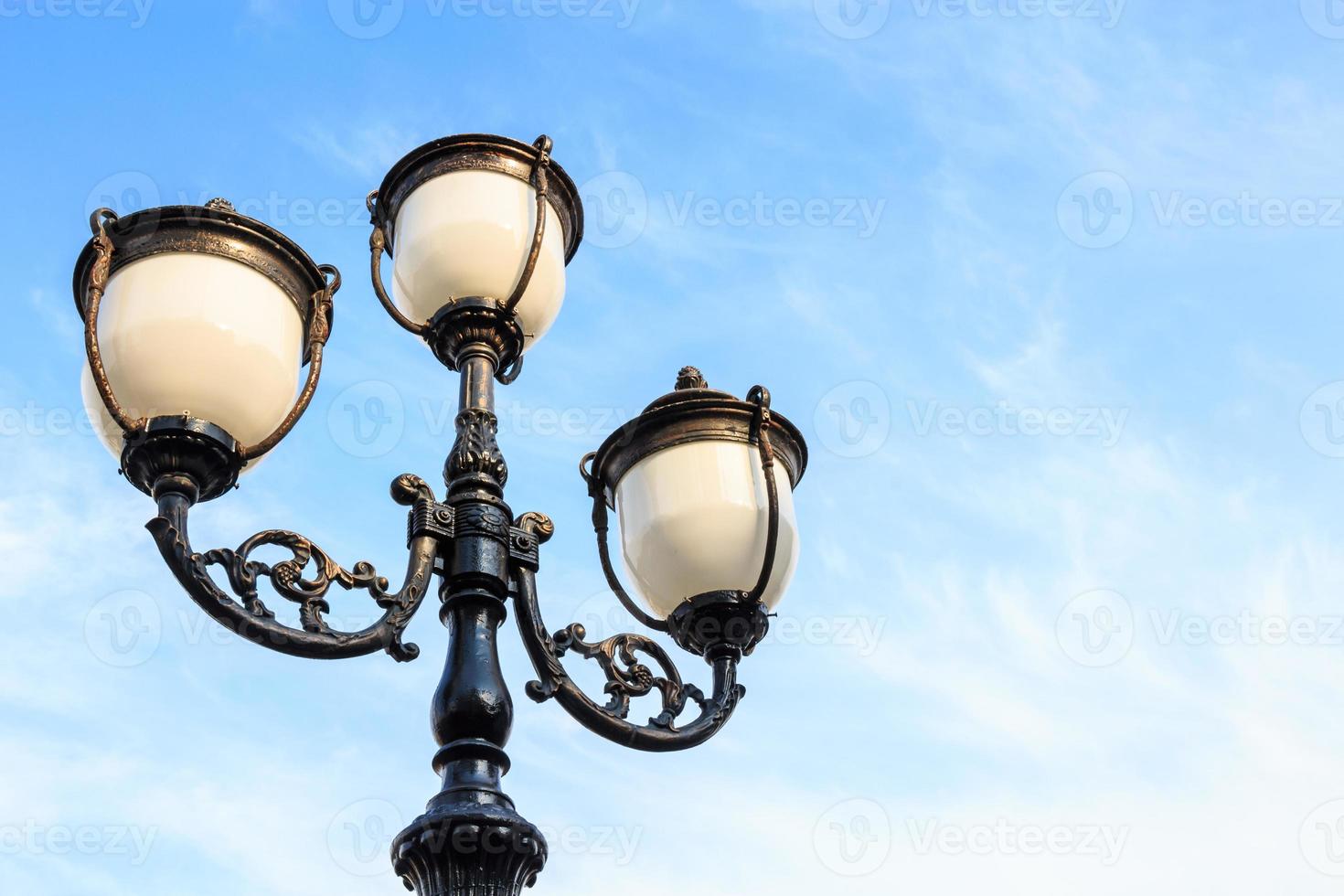 the street lamp and blue cloudy sky with blank area at right side photo