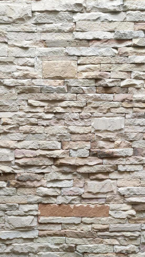 Fondo de textura de patrón de pared de piedra blanca foto