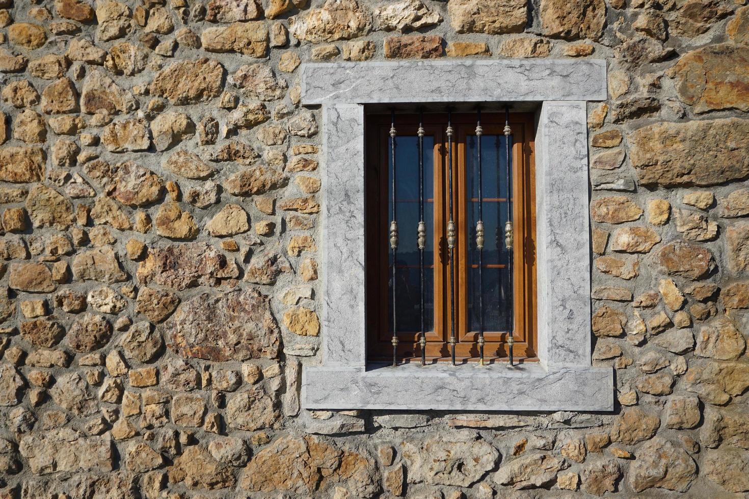 window on the old facade of the house photo