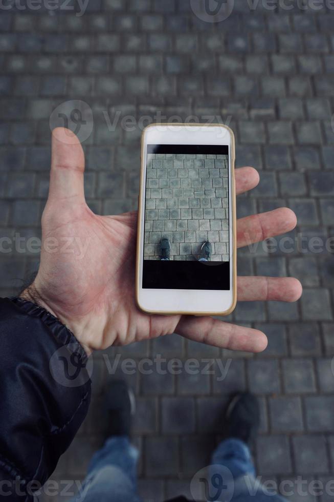 hand with a smartphone taking photos