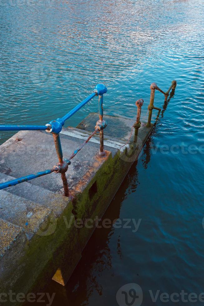 old abandoned stairs in the seaport photo