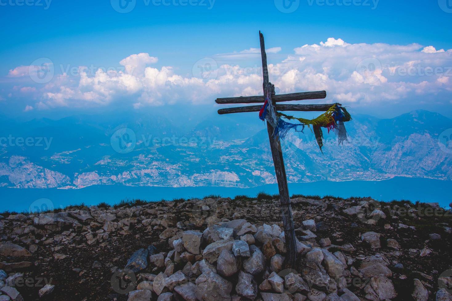 Wooden cross on a mountain photo