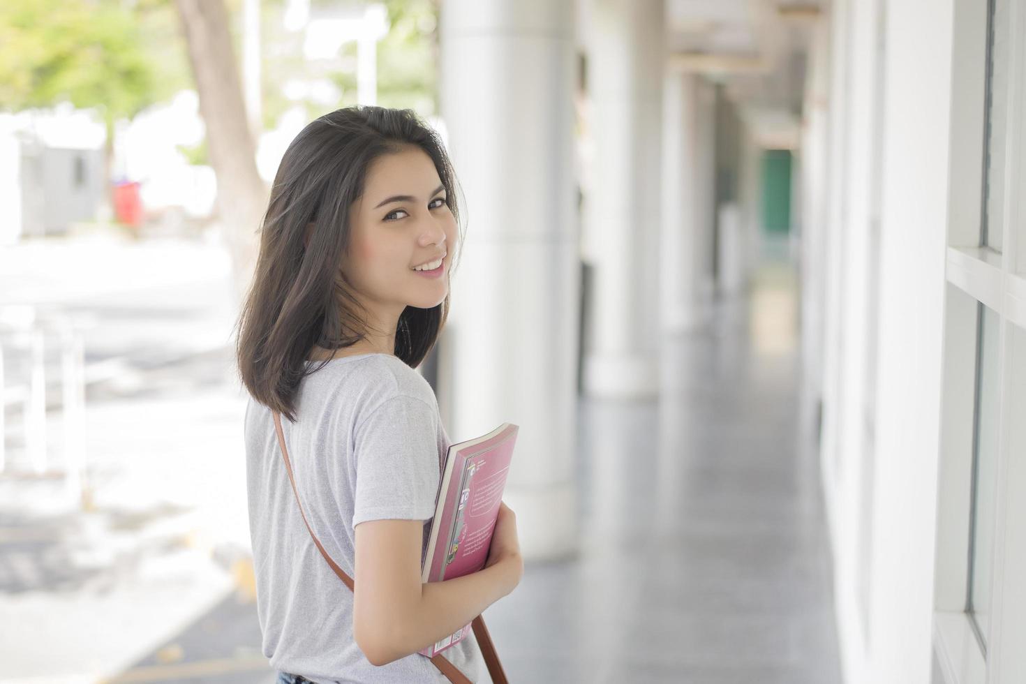 A portrait of an Asian university student on campus photo